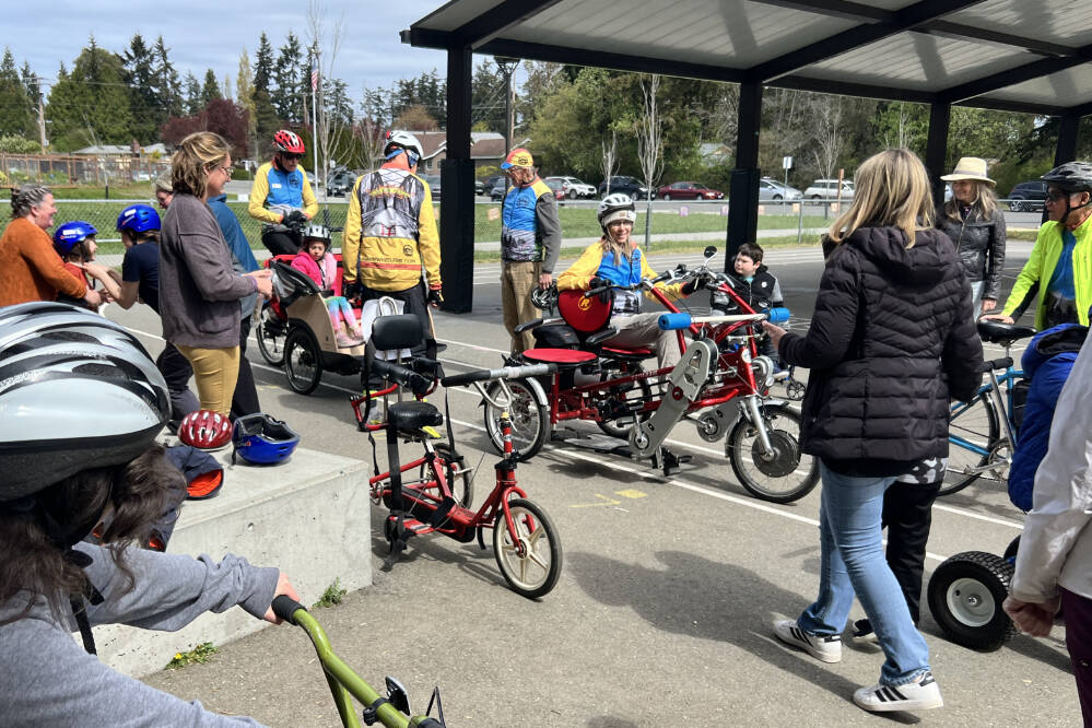 Photos courtesy of Sequim Wheelers
Volunteers from Sequim Wheelers offer rides and speak with students at Salish Coast Elementary School in Port Townsend in April.