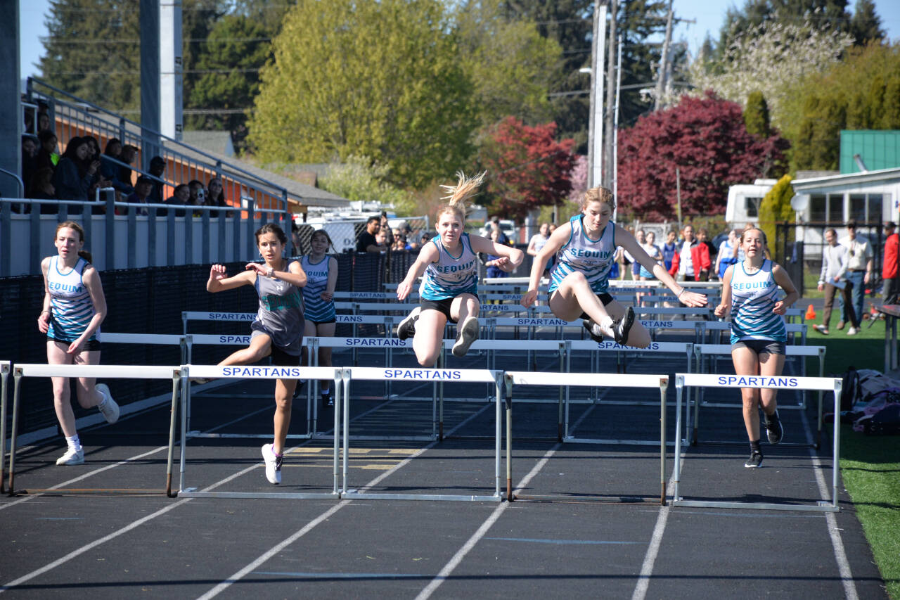 Photos COURTESY OF Caleb Gentry
Sequim Middle School hurdlers (from left) Teagan Neatherly, Kalea Keate, Kylie Peters, Stella Dennis and Kaiya Robinson race to the finish line in a league meet at Forks earlier this season.