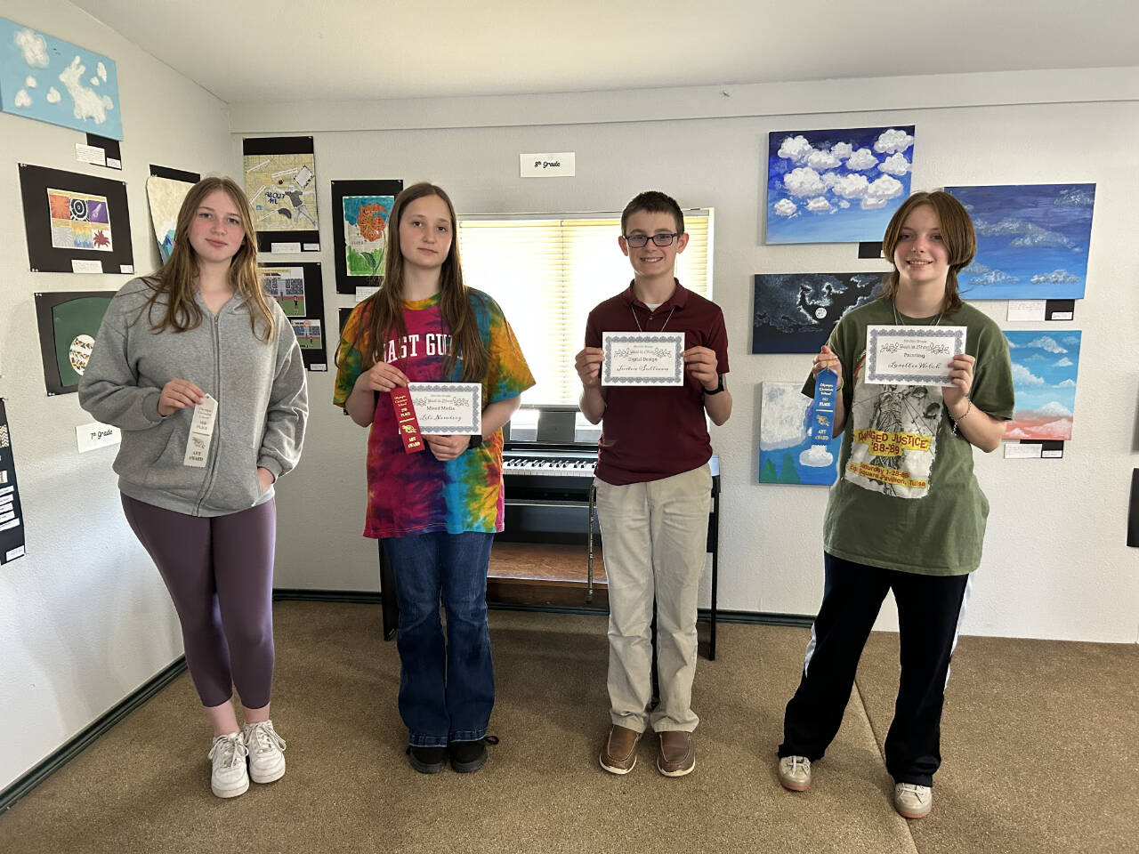 Photo courtesy of Olympic Christian School
From left, Olympic Christian School eighth-graders Miya Allen, Lili Newberg, Justin Sullivan and Lorellie Welch display their honors at OCS’s annual Art Festival.