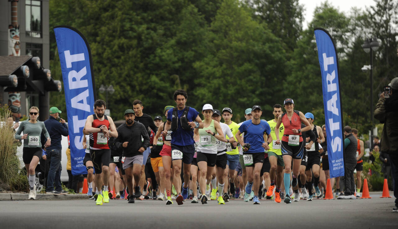 Sequim Gazette photo by Michael Dashiell / Runners break from the start of the North Olympic Discovery Marathon at 7 Cedars Resort on June 2. At left in red is the men’s marathon winner Derek Binnersley.