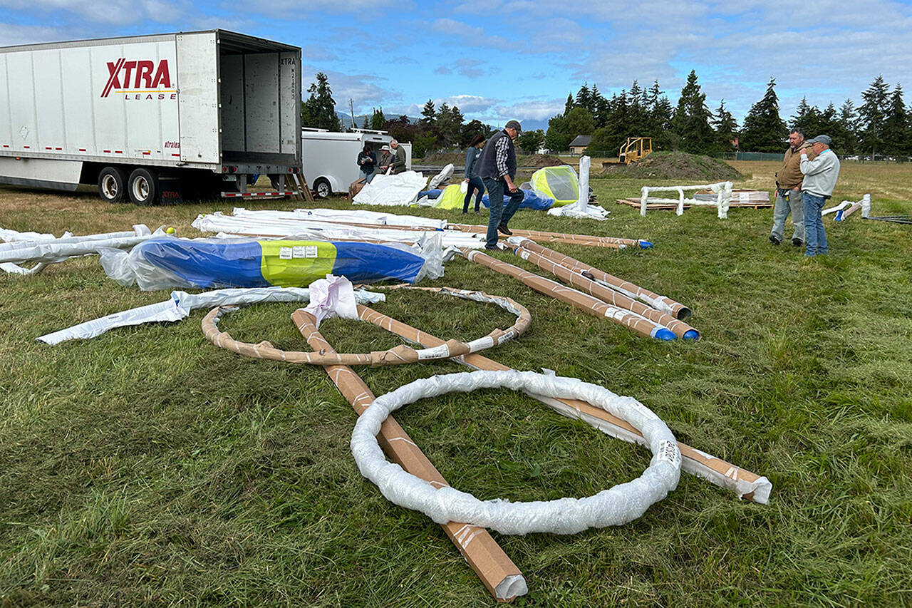 Sequim Gazette photo by Matthew Nash
Olympic View Church volunteers unload and sort inclusive playground equipment for their first phase of The Gathering Ground project off Brown Road.