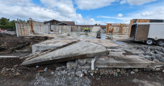 Workers with Hoch Construction remove much of the structure at the Sequim Library location, 630 N. Sequim Ave., in preparation for the major expansion project. (Noah Glaude/North Olympic Library System)