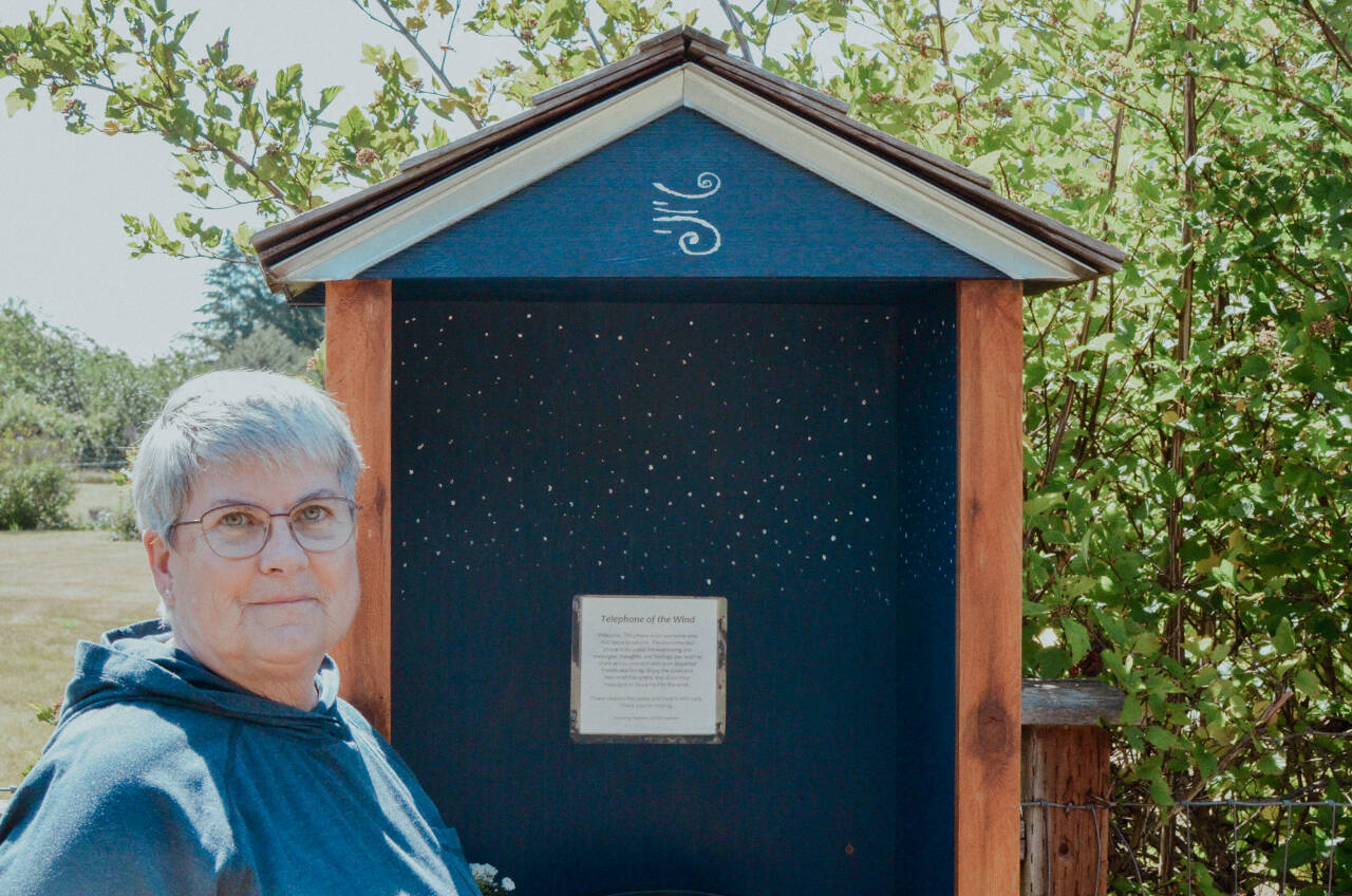 Sequim Gazette photo by Elijah Sussman / Diane Fatzinger stands near her wind phone located across from the Sequim School District soccer fields on the Olympic Discovery Trail.