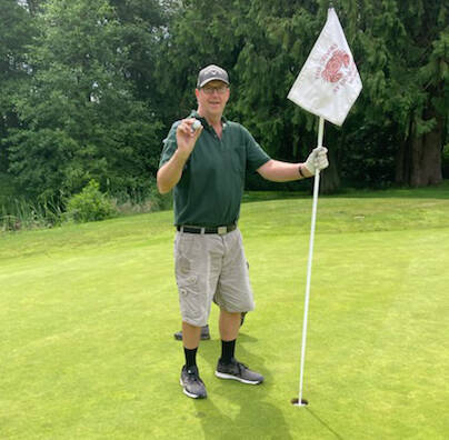 Photo courtesy of The Cedars at Dungeness
Jim Boekhoff of Sequim shows the ball he used to ace hole No. 17 at The Cedars at Dungeness in late June.