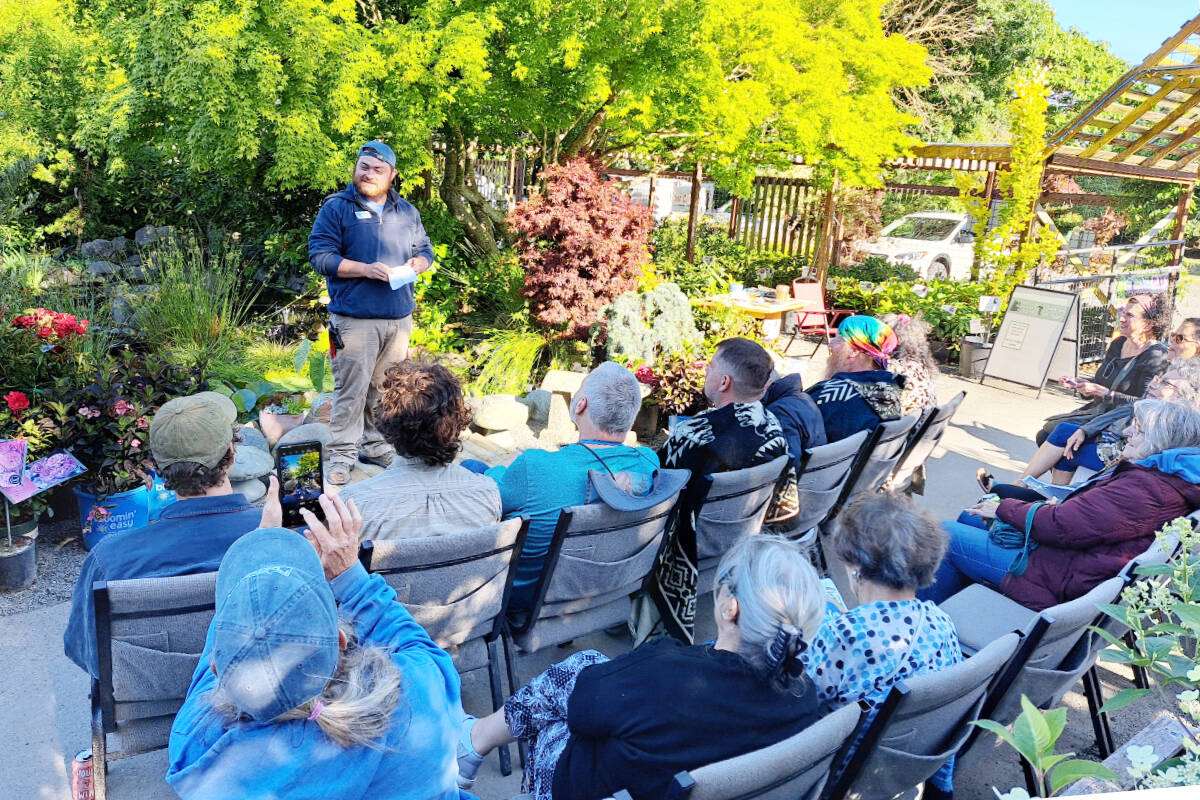 Stew Cockburn, from New Dungeness Nursery in Sequim chats with guests during an event at the nursery. “When I think of all the gardens I’ve ever been in, if ‘enhancing human well-being’ wasn’t the goal, I don’t know what is,” Stew says.