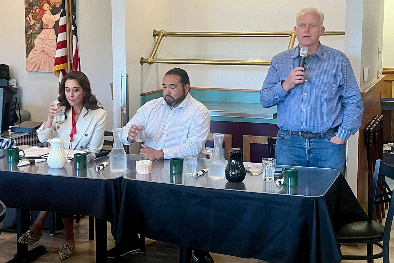 Photo by Peter Segall/Olympic Peninsula Daily News Group / Republican Jaime Herrera Beutler, left, and Democrats Patrick DePoe, center, and Kevin Van De Wege, all candidates for state Commissioner of Public Lands, met before the Port Angeles Business Association on July 9 to discuss their priorities for leading the Department of Natural Resources.