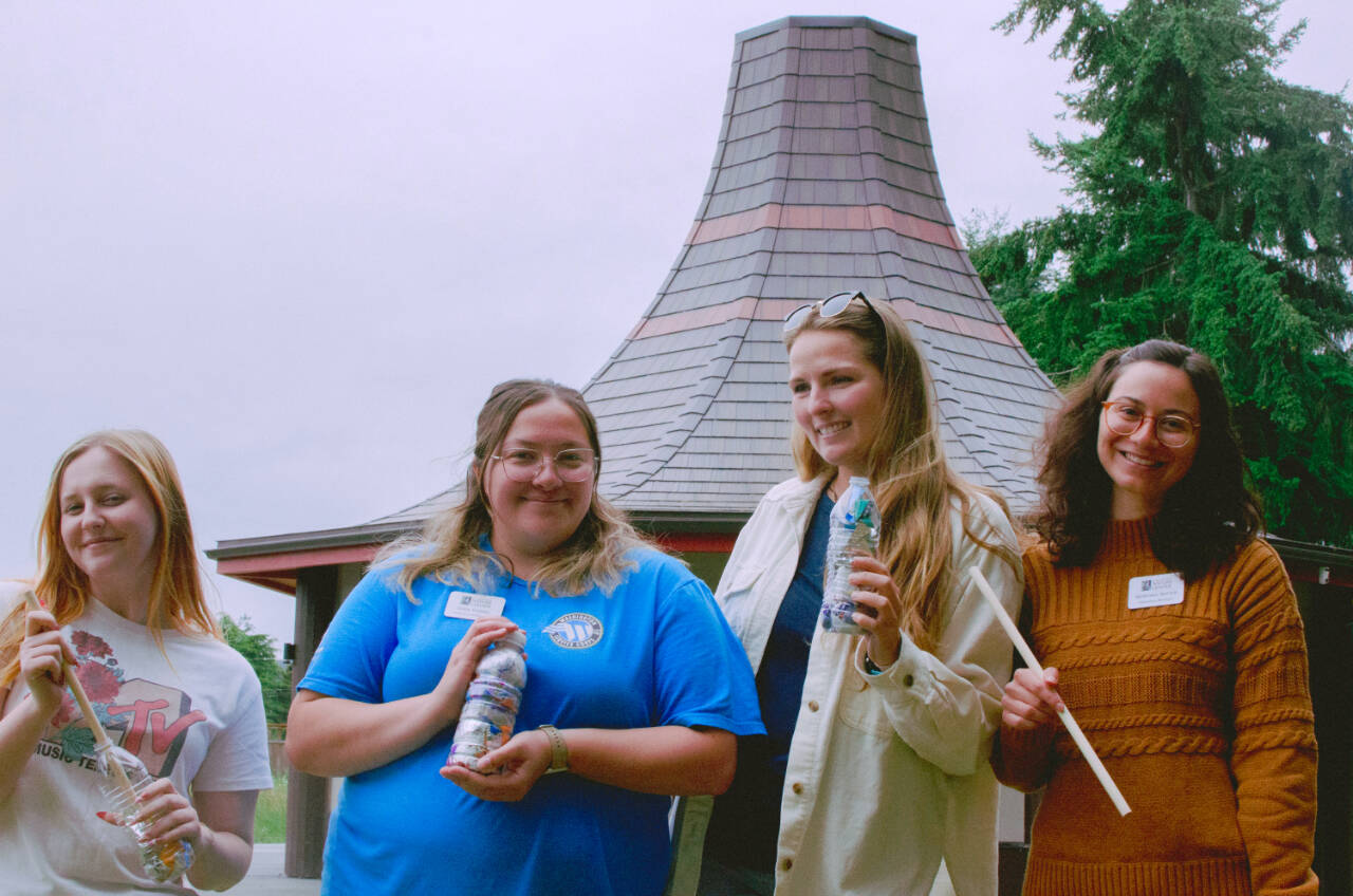 Sequim Gazette photo by Elijah Sussman / From left, Ruby Coulson, Eden Voebel, Jordan Higgins, and Montana Napier stand in front of Cedar Hat House at Dungeness River Nature Center on June 26.