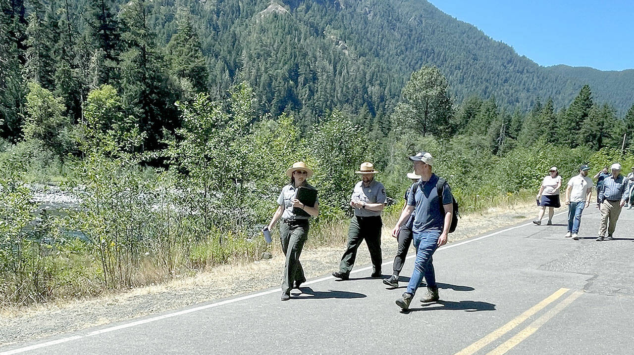 Photo by Paula Hunt/Olympic Peninsula News Group
Olympic National Park Superintendent Sula Jacobs, left, and U.S. Rep. Derek Kilmer, D-Gig Harbor, walk on Olympic Hot Springs Road next to the Elwha River about a mile south of Madison Falls on July 15. Kilmer and Rep. Mike Quigley, D-Illinois, led five other U.S. House members on a two-day visit where they met with park scientists to discuss how changes in the climate are impacting national parks.