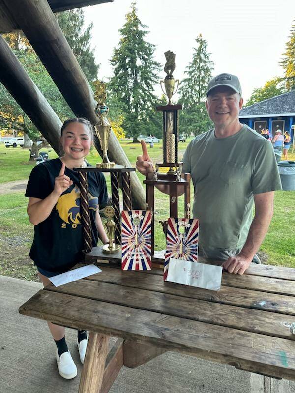 Photo courtesy of Bates family
Bill and Hannah Bates of Sequim celebrate a win at the Forks Cornhole 4th of July Tournament. The father-daughter team topped a field of 74 teams to take top honors.