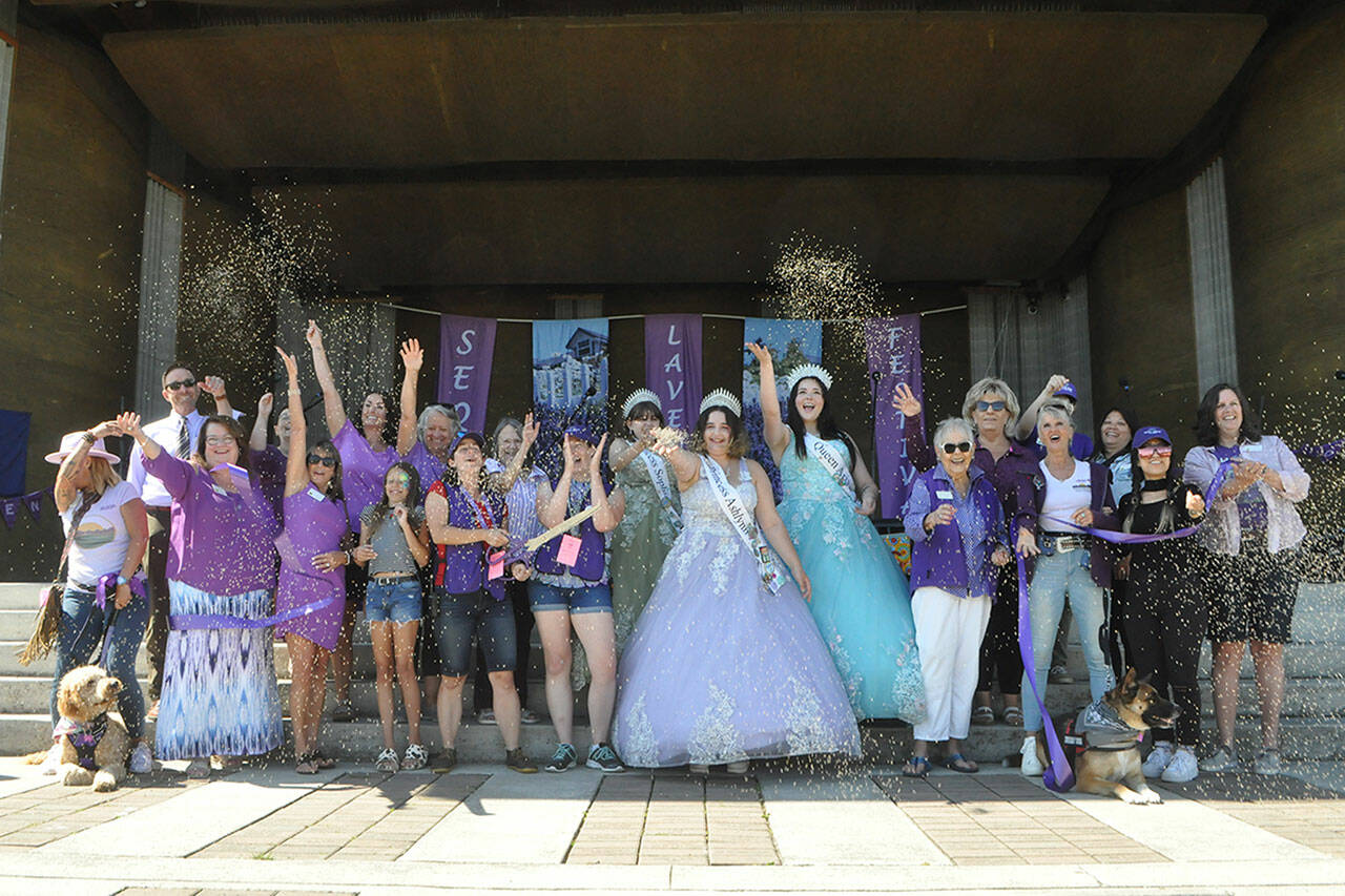 Sequim Gazette photo by Matthew Nash/ Sequim Lavender Festival leaders opened its festivities in Carrie Blake Community Park with a ribbon cutting on July 19 in conjunction with the Sequim-Dungeness Valley Chamber of Commerce. Sequim Lavender Weekend, which includes the Lavender Festival, goes through Sunday, July 21, and features live music, food, activities, events and farms throughout the area.