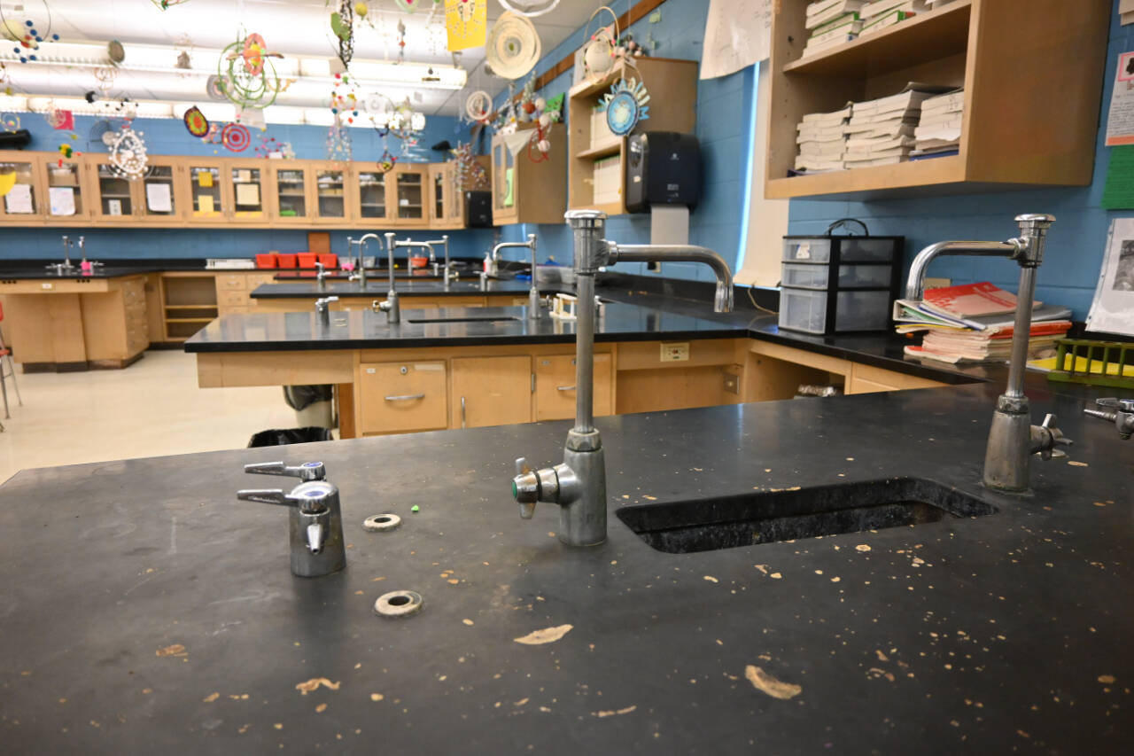 Sequim Gazette photo by Michel Dashiell / Members of the Sequim School District’s Long Range Facilities Planning Group got a look at Sequim High School’s aging science classrooms. The four classrooms were built in 1967. Adjacent to the classrooms is a storage area with rows upon rows of chemicals used in classroom studies without nearly the ventilation needed, according to Mike Santos, Sequim schools’ Director of Facilities, Operations, and Security.