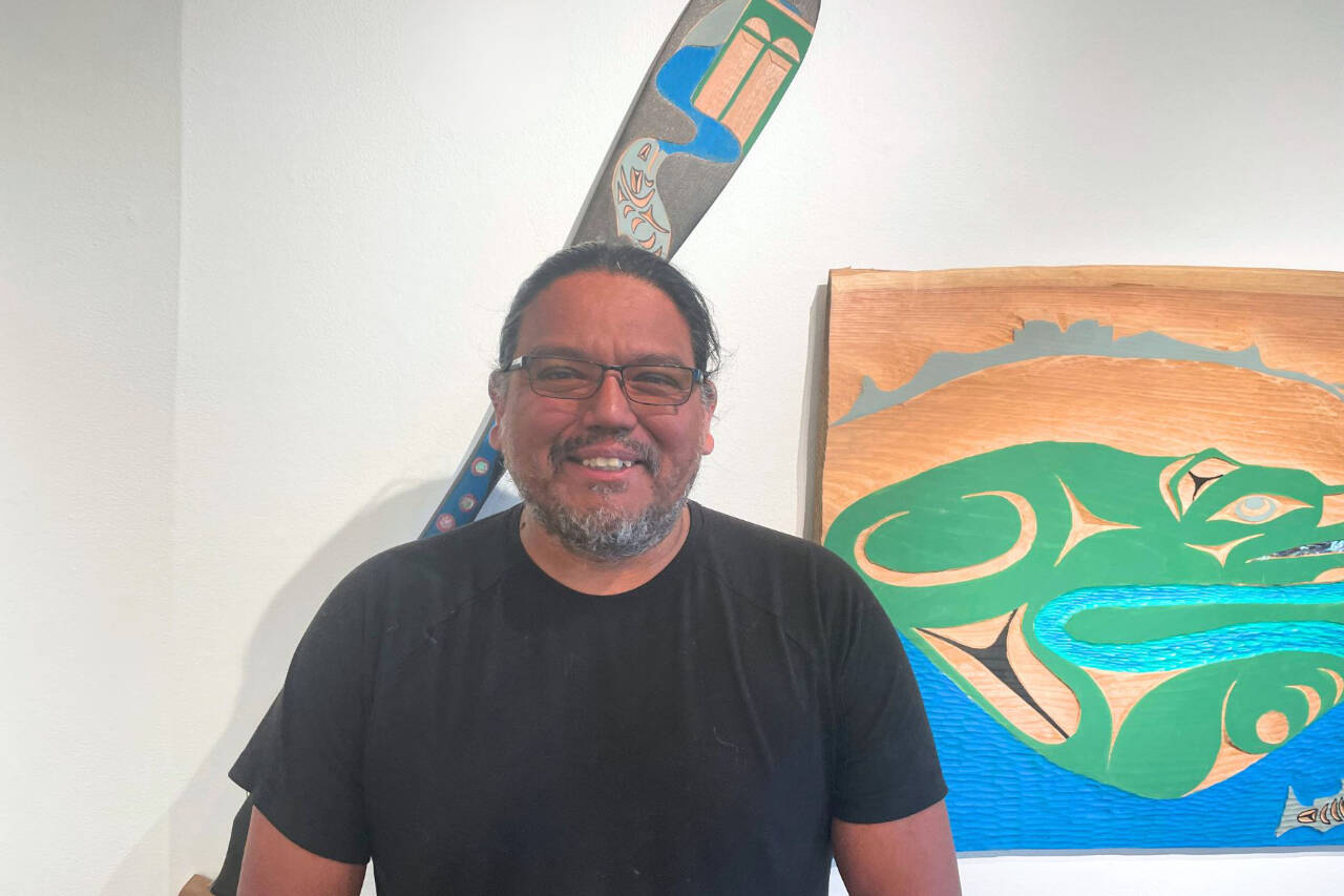 Photo courtesy of Port Angeles Fine Arts Center
Featured artist Darrell Charles stands in front of his artwork in the “Beauty and Resilience” exhibit at the Port Angeles Fine Arts Center. The center hosts a Second Saturday Art Walk from 3-6 p.m. on Aug. 10 at 1203 E. Lauridsen Blvd., Port Angeles.