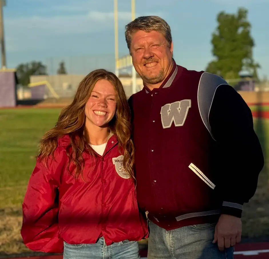 Photo courtesy of Pyeatt family / Sequim High grad, Riley Pyeatt celebrates her transfer to Washington State University with former high school coach BJ Schade, also a Sequim High grad and a WSU track standout, at the Sequim High track in early August.