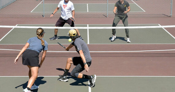 Pickleball players, clockwise from upper left, Richard Reed and Lucah Folden of Port Angeles, and Yukon Lam and Marike Nel of Sequim play on the courts at Elks Playfield in Port Angeles on Wednesday. (Keith Thorpe/Peninsula Daily News)