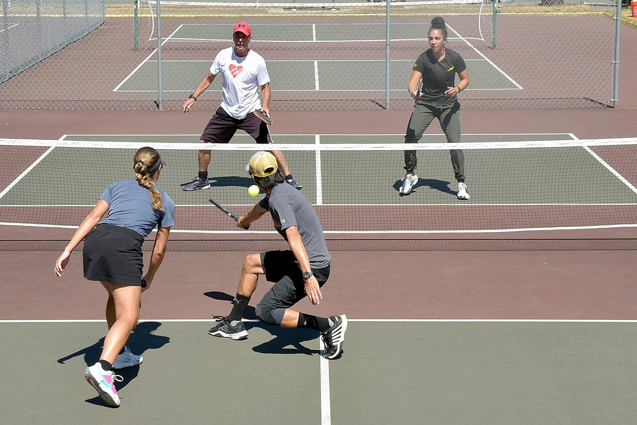 Photo by Keith Thorpe/Olympic Peninsula News Group / Pickleball players, clockwise from upper left, Richard Reed and Lucah Folden of Port Angeles, and Yukon Lam and Marike Nel of Sequim play on the courts at Elks Playfield in Port Angeles on Wednesday.