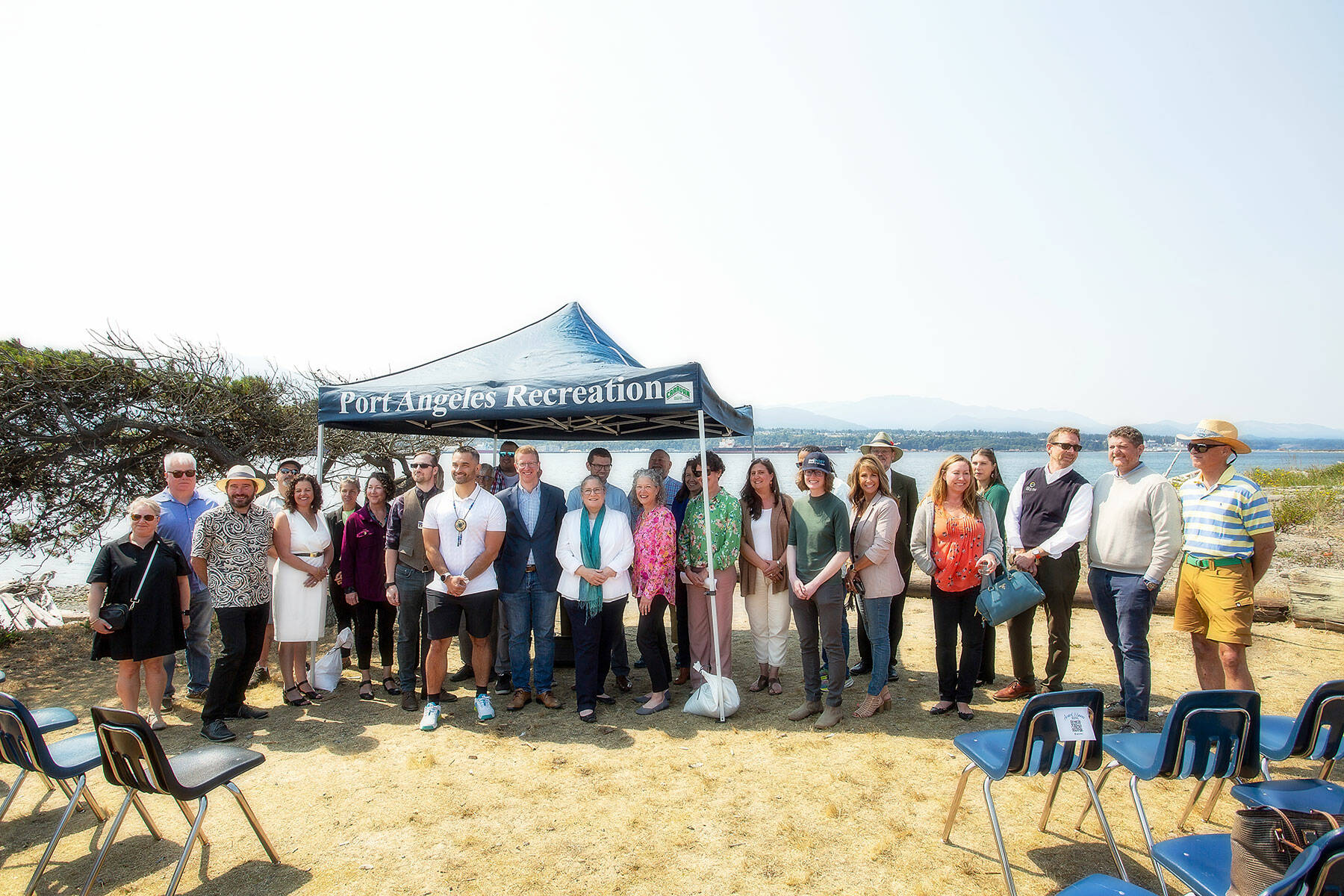 Photo by Christopher Urquia/Olympic Peninsula News Group
U.S. Rep. Derek Kilmer, D-Gig Harbor, and members of the North Olympic Peninsula Recompete Coalition stand together following a press conference at Harborview Park in Port Angeles on Aug. 10.