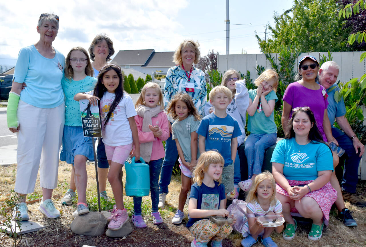 Photo courtesy of Clallam County Master Gardeners
Sequim Boys and Girls Club Garden Club participants and Master Gardeners dedicate a new garden area of native plants. Boys and Girls Club gardeners pictured, from left, include Lucia Claypool, Nevaeh Moreno, Rylee Schmidt, Meadow Perry, Walter Dunscomb, Destiny Summers, and Fisher McCullem, and sitting in the front Kassandra Nelson, Madison Sielsky, and Boys and Girls Club art room coordinator Makaela Baker. Master Gardeners pictured in back row include, from left, Jan Danford, Vicki Bates, Jo Jarl, Pamela Yu and John Norgord.