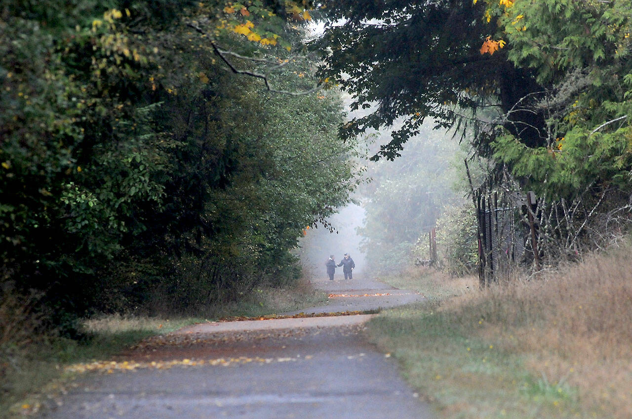 Photo by Keith Thorpe/Olympic Peninsula News Group
Walkers make their way along a foggy portion of the Olympic Discovery Trail near William R. Fairchild International Airport in Port Angeles in fall 2023.