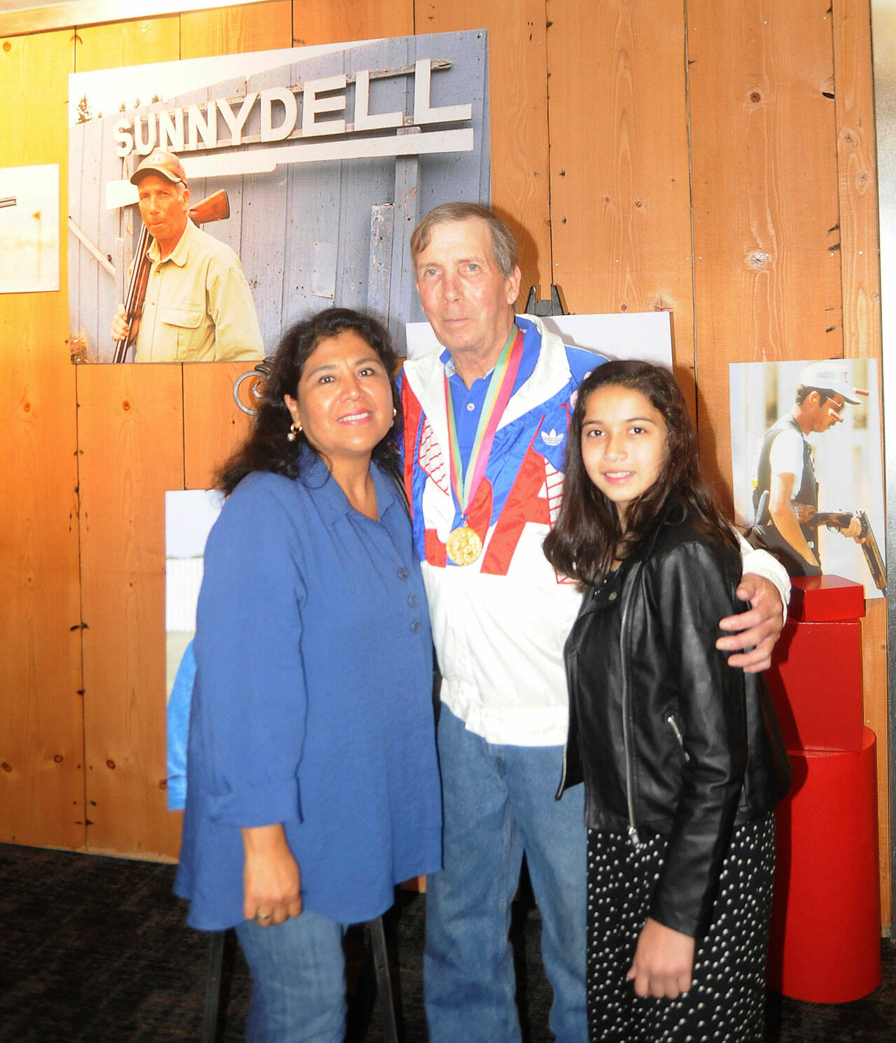 Sequim Gazette file photo by Michael Dashiell
Matt Dryke, 1984 Olympic Games gold medal winner (skeet shooting), joins his wife Yvonne and daughter Ellen at the opening of the new Sequim Museum & Arts building in July 2019. A section of the museum details Dryke’s storied career in the sport.