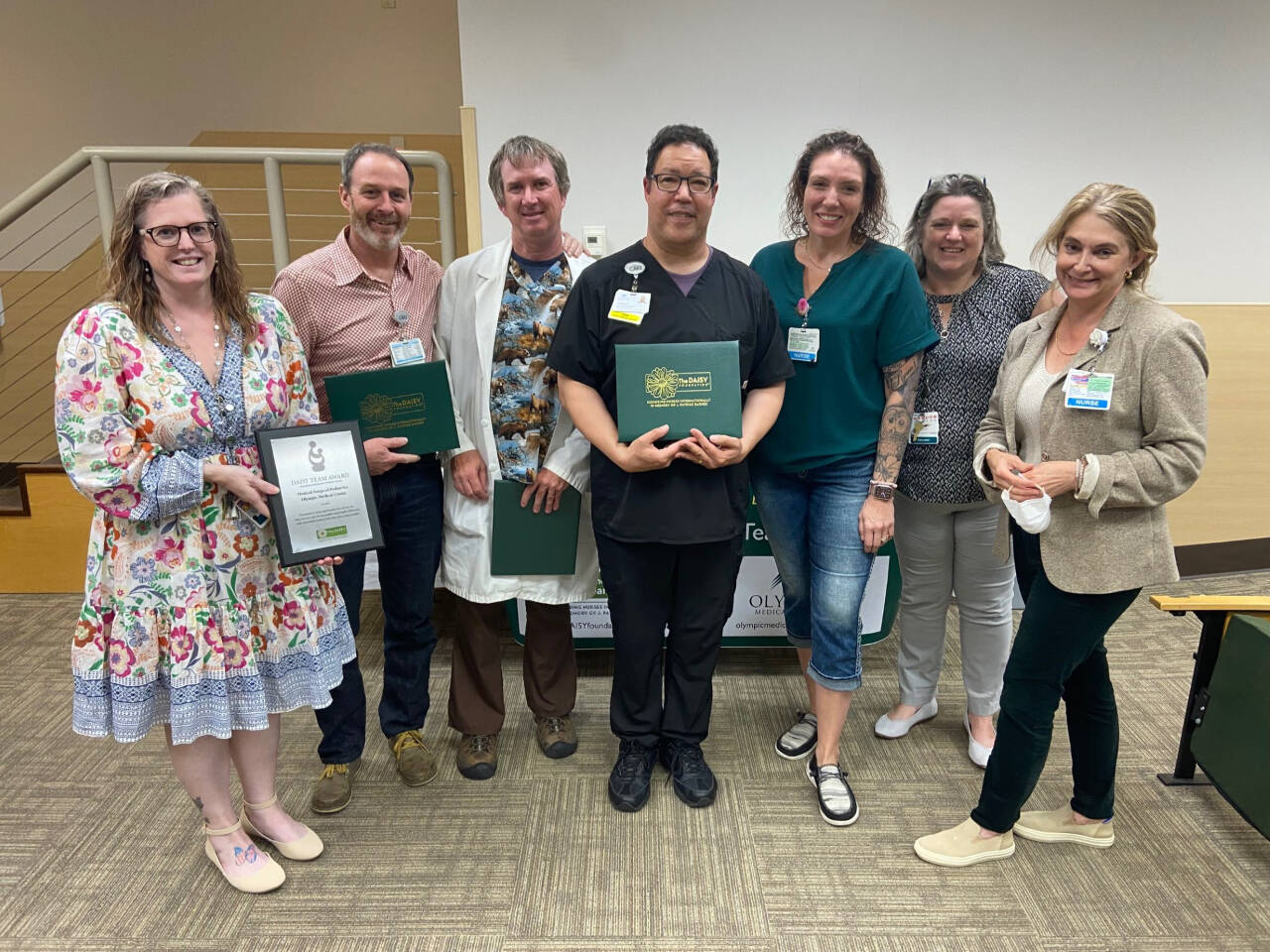 Photo courtesy of Olympic Medical Center
Olympic Medical Center Medical/Surgical team members accept the DAISY Team Award for Extraordinary Nurses. Pictured, from left, are: Denise Harmon, OMC’s medical/surgical/pediatrics director; team members Justin Snook, Jake Tupper, Franklin Edwards and Amber Valdez-Black; clinical educator/RN Laura Dotlich, and Chief Nursing Officer Vickie Swanson.