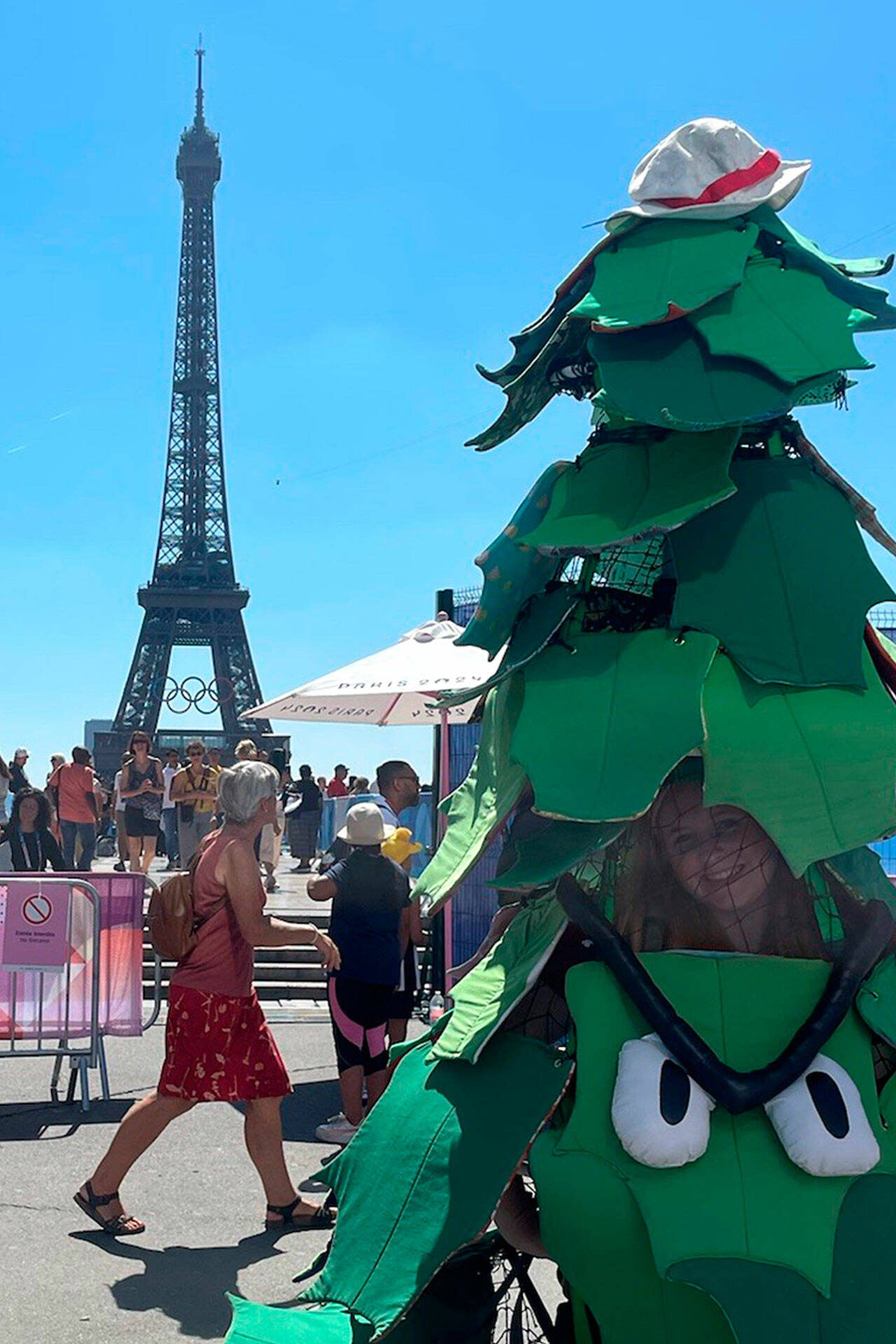 Photos courtesy Stanford Athletics
Above: Ruby Coulson of Sequim stands in Paris as the Stanford Tree during the Olympics with the Eiffel Tower in the background. During her recent trip she met and interviewed past and present Stanford athletes who competed in the Olympics.