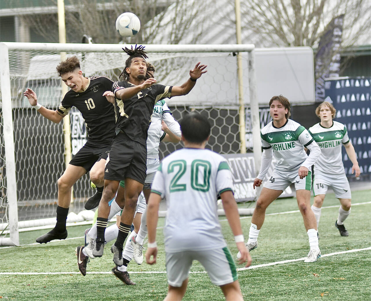 Photo by Jay Cline/Peninsula College
Peninsula College’s Nil Grau, left, and Abdurahim Leigh battle for a ball in front of the Highline net in Tukwila in a 2023 match. Grau returns to the Pirates in 2024 after earning the North Region MVP with eight goals and 10 assists.