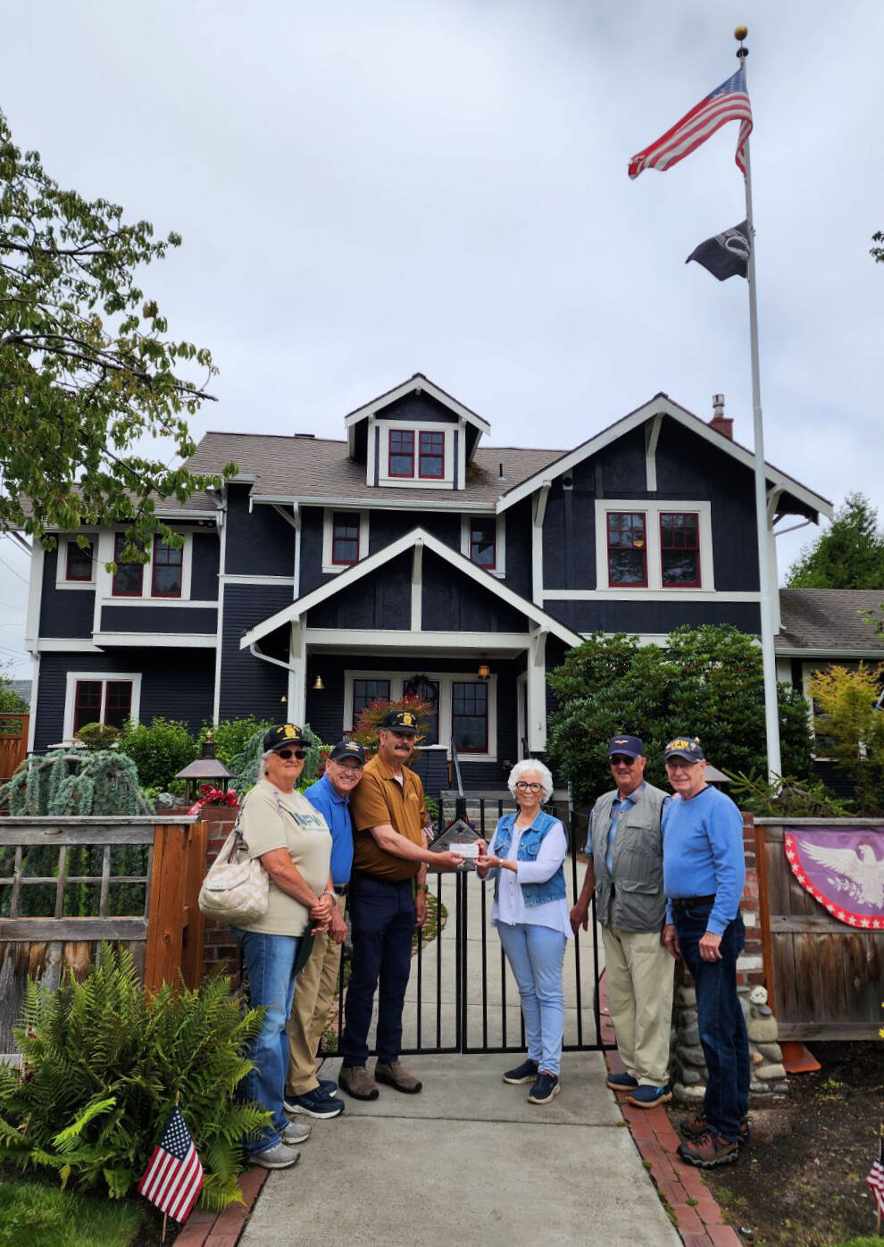 Photo by Claire Rausch
Carlsborg VFW Post 6787 representatives present a donation to the Captain Joseph House Foundation. Pictured, from left, are VFW representatives Denise Ashbran, Alan Morris and Commander Dave Yarnchak, Captain Joseph House founder Betsy Reed Schultz, and VFW representatives Gary Vetie and Tom Cox.