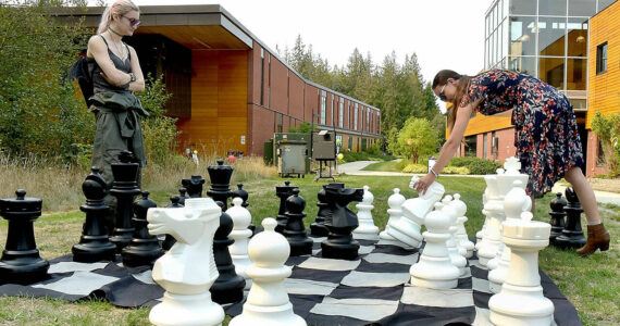 Photo by Keith Thorpe/Olympic Peninsula News Group
Nova Hines, left, and Nic Marquardt, both of Sequim, play a game of chess on an oversized board during the 2024 Fall Spectacular at Peninsula College in Port Angeles on Sept. 7. The event featured food, music, informational displays and activities for children and adults.