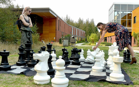 Photo by Keith Thorpe/Olympic Peninsula News Group
Nova Hines, left, and Nic Marquardt, both of Sequim, play a game of chess on an oversized board during the 2024 Fall Spectacular at Peninsula College in Port Angeles on Sept. 7. The event featured food, music, informational displays and activities for children and adults.