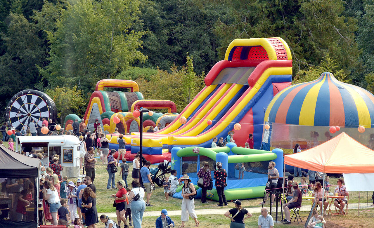 Photo by Keith Thorpe/Olympic Peninsula News Group /A collection of inflatable toys entertain children on Robin’s Green at Peninsula College in Port Angeles on Sept. 7 as part of the college’s Fall Spectacular.