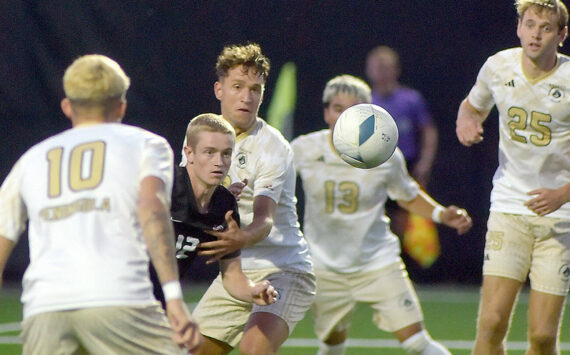 KEITH THORPE/PENINSULA DAILY NEWS
Everett's Lunden Fenster, second from left, eyes a loose ball surrounded by Peninsula's (from left) Nil Grau, Konrad Mueller, Ezrrah Ochoa, and Sid Gunton-Day on Wednesday night in Port Angeles.