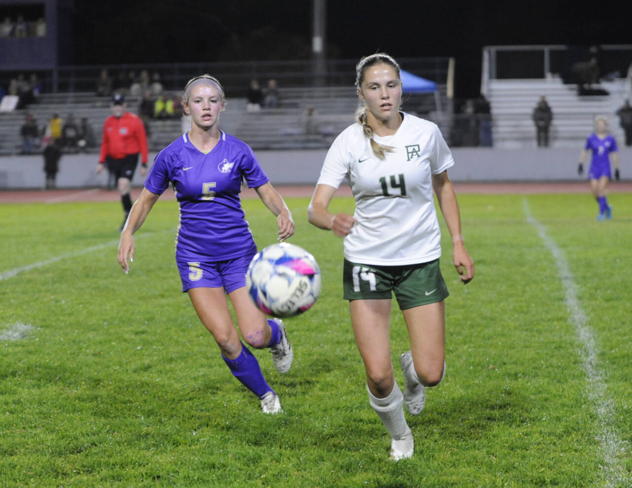 Sequim Gazette photo by Michael Dashiell
Sequim’s Ivy Barrett, left, and Port Angeles’ Sophia Ritchie vie for possession in the first half of an Olympic League showdown on Sept. 26. Port Angeles edged the Wolves 3-2 in overtime.