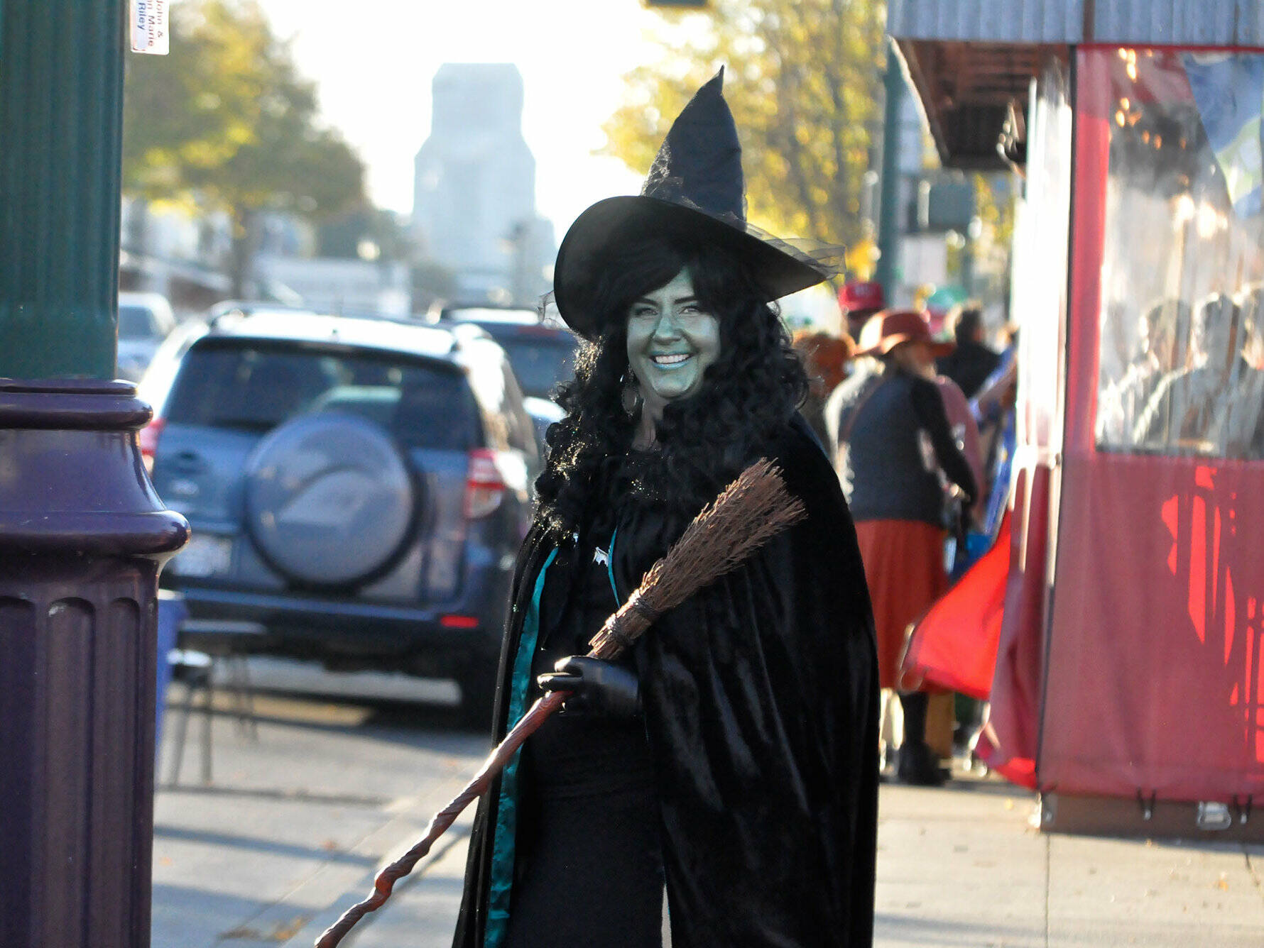 Sequim Gazette file photo by Matthew Nash
As the Wicked Witch from “The Wizard of Oz,” Beth Pratt, executive director of the Sequim-Dungeness Valley Chamber of Commerce, helps trick-or-treaters cross Washington Street last Halloween. Merchants offer trick-or-treating once again on Halloween from 3-5 p.m. Oct. 31 along Washington Street from Creamery Square to Fifth Avenue