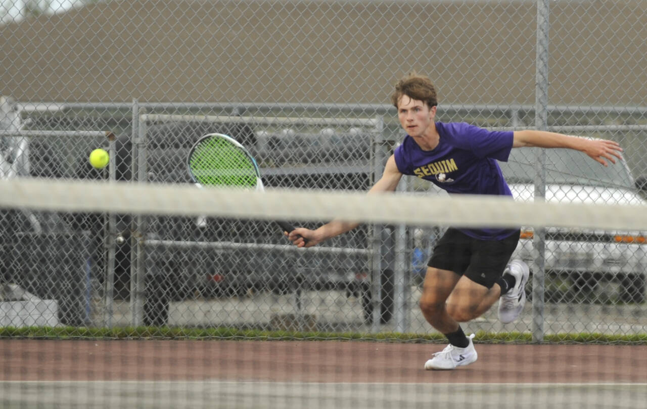 Sequim Gazette photo by Michael Dashiell / Sequim’s Mason Rapelje chases down a short volley in a No. 3 singles matcha against Bainbridge on Oct. 7. Rapelje topped Spartan Connor Firth in straight sets, 6-0 and 6-1.