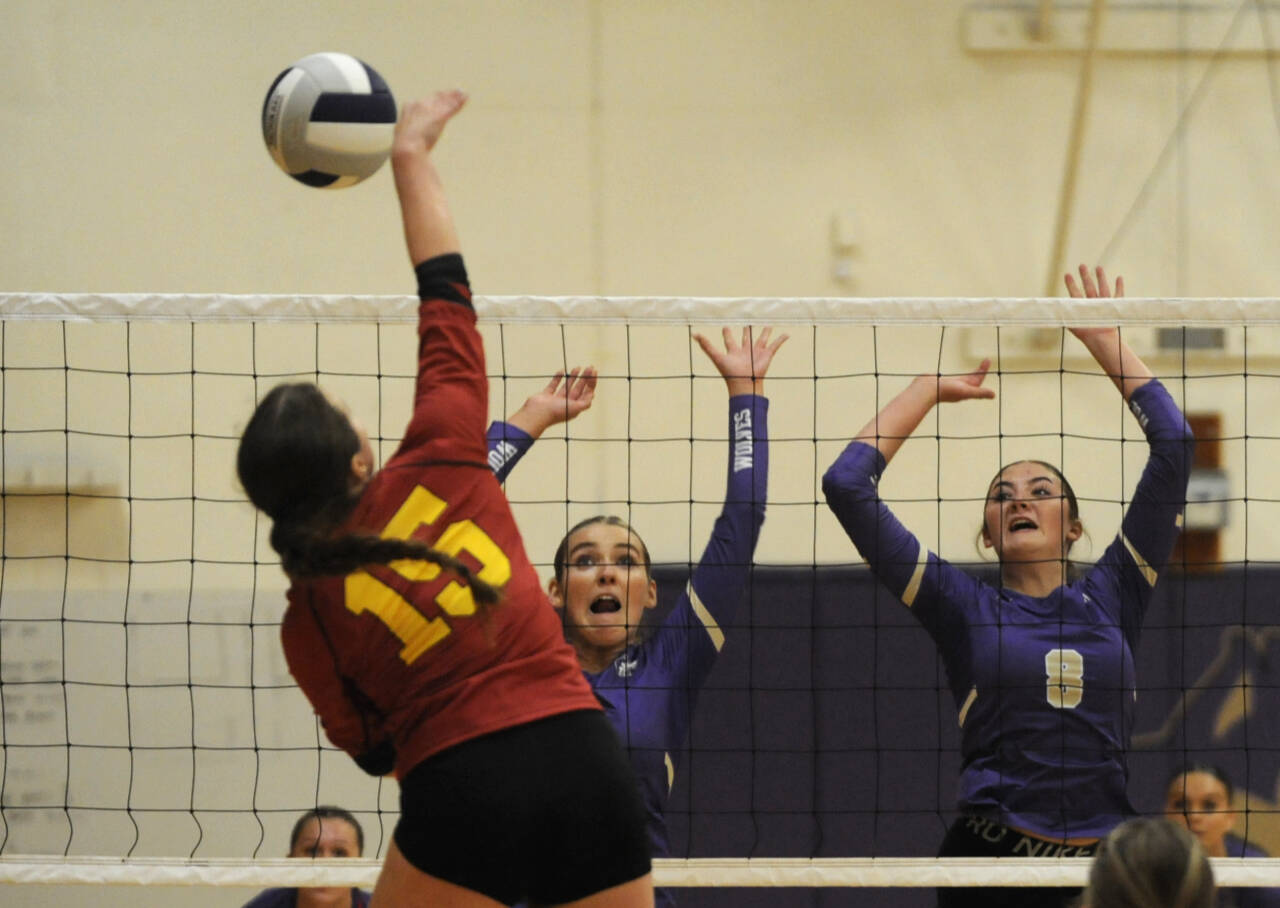 Sequim Gazette photo by Michael Dashiell
Sequim’s Sydney Clark, left, and Rose Gibson look to block a shot by Kingston’s Maddie Brown in SHS’s 3-0 win over the Buccaneers on Oct. 8.