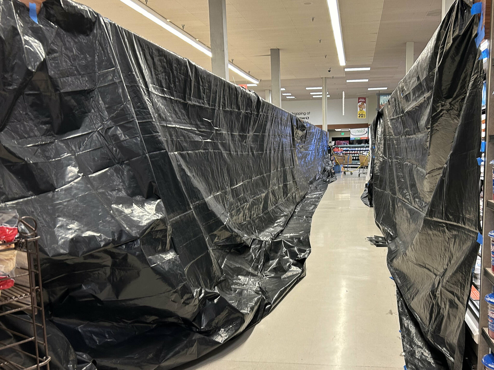 Sequim Gazette photo by Matthew Nash/ After electricity was restored in the City of Sequim on Oct. 18, staff reopened Safeway to customers but frozen and refrigerated goods were covered up for preservation.