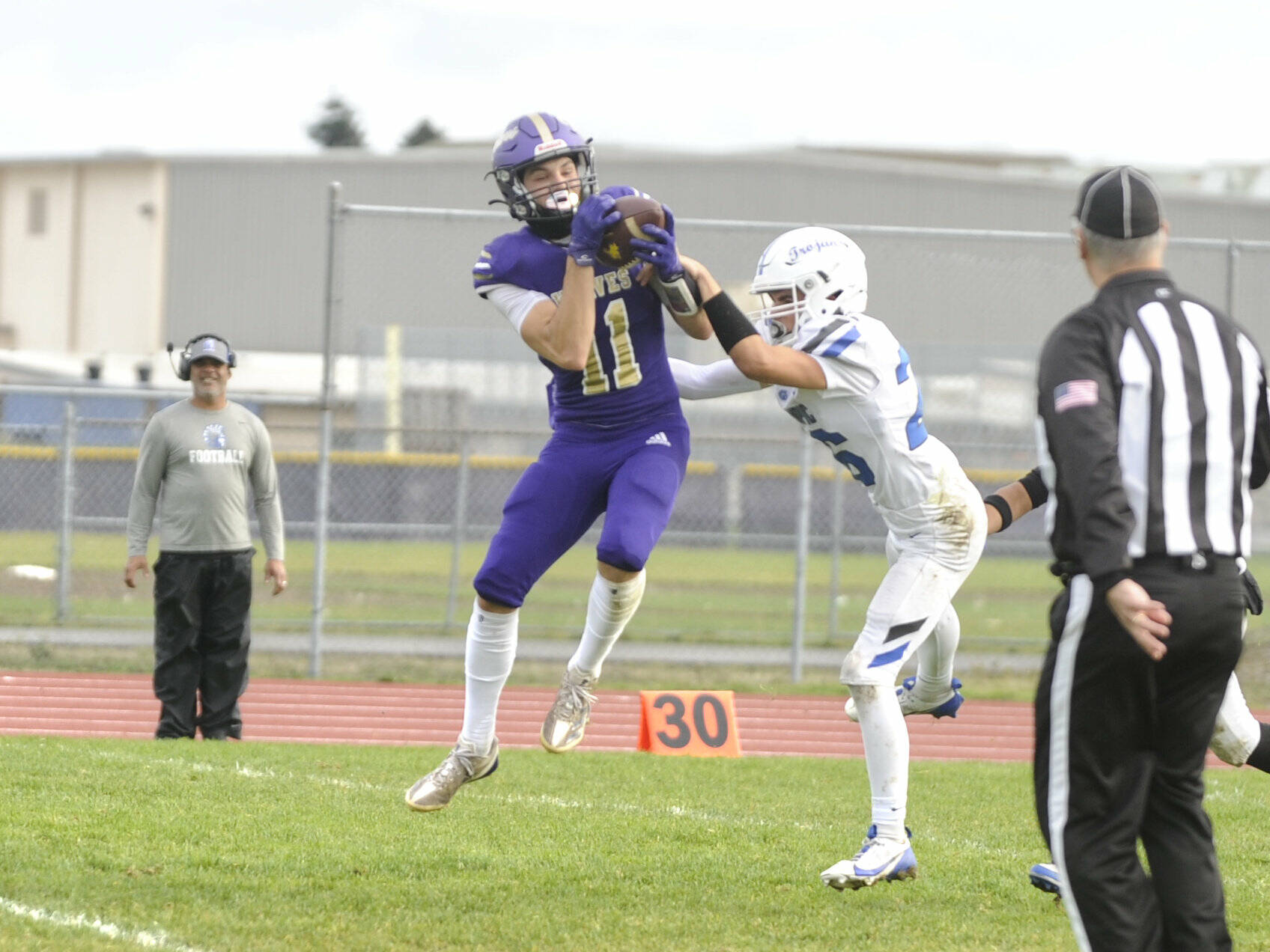 Sequim Gazette photos by Matthew Nash
Sequim’s Charlie Grider makes a catch for a first down against Olympic on Oct. 19.