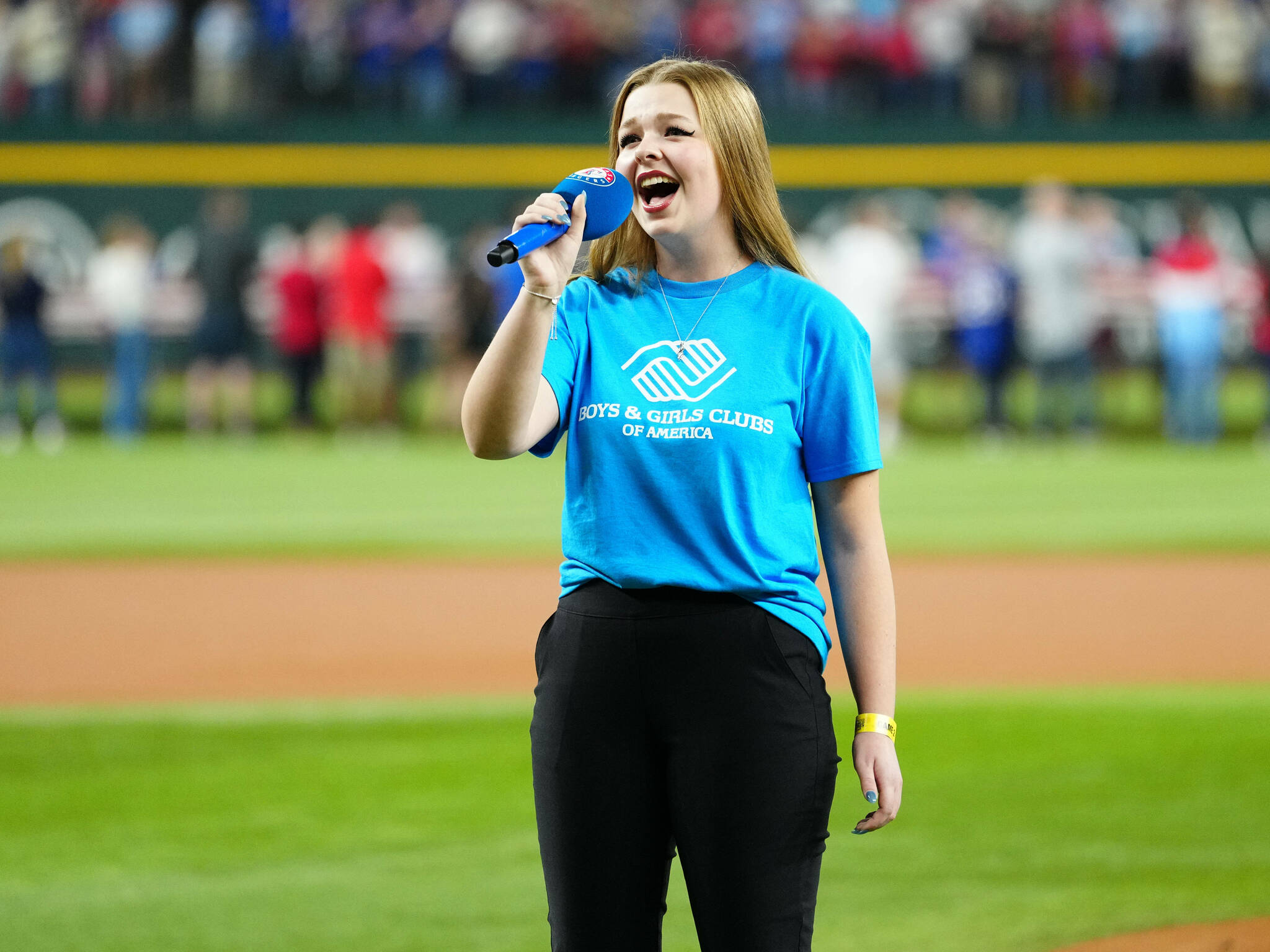 Photo by Mary DeCicco/MLB Photos via Getty Images/ Boys & Girls Clubs Youth Performer Pearle Peterson of Sequim sings the national anthem prior to Game 2 of the 2023 World Series between the Arizona Diamondbacks and the Texas Rangers on Oct. 28 in Arlington, Texas. She sings again at the World Series in Los Angeles on Oct. 26, 2024.