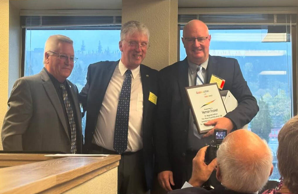 Photo courtesy of Lynn Fosket
Vern Fosket of Sequim (right) accepts a NW Bandmasters honor on Oct. 27 from NW Bandmasters president Rick White and Brad McDavid.