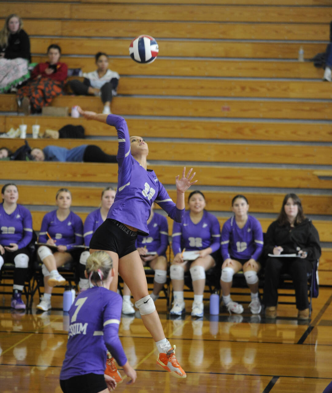 Sequim Gazette photo by Michel Dashiell
Sequim teammates look on as senior Arianna Stovall lines up a hit in the second set of an Olympic League tourney match at Bainbridge on Nov. 2.