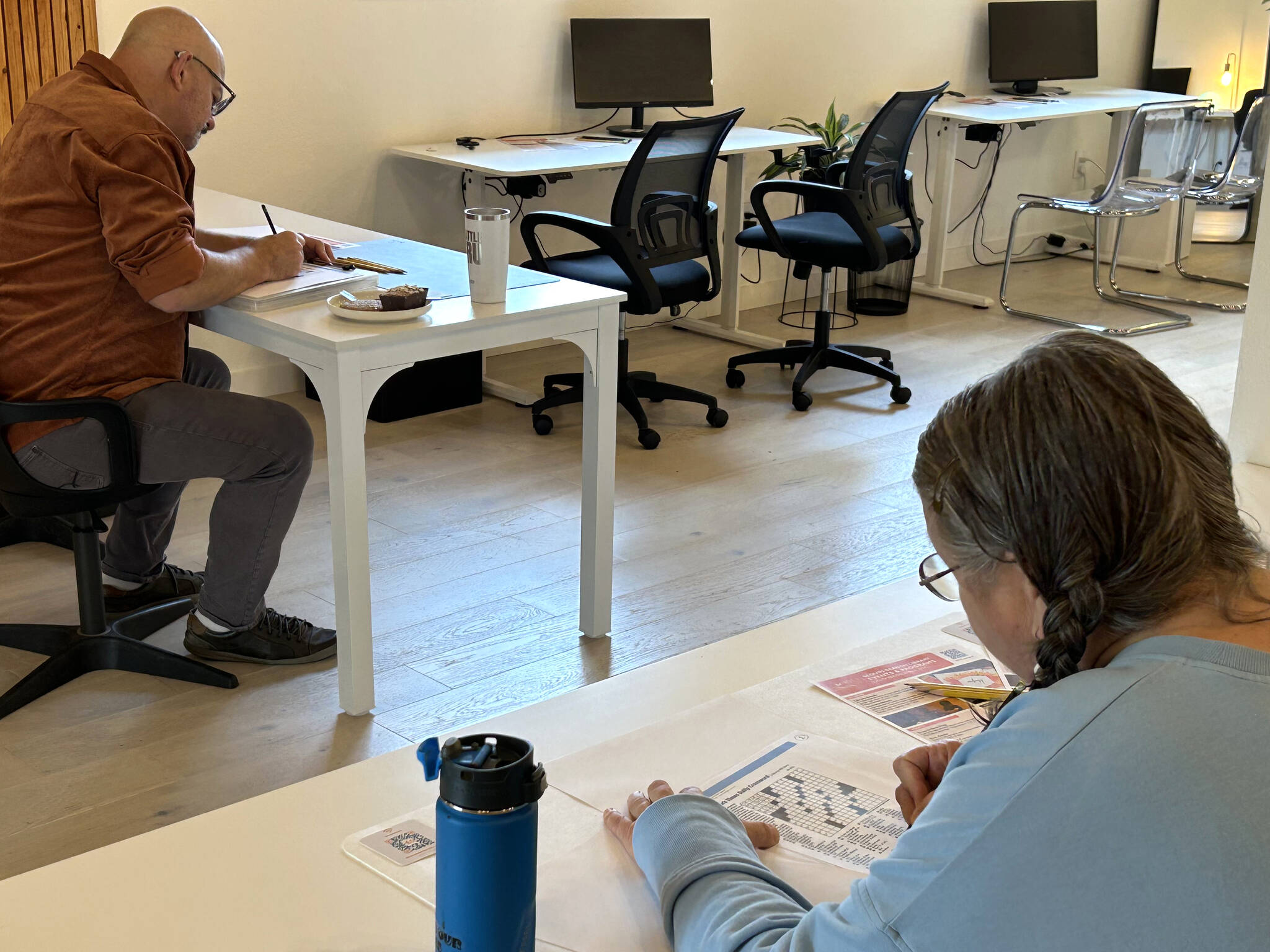 Sequim Gazette photo by Matthew Nash/ Joseph Fountain and Mary Givins compete in NOLS’ Sequim crossword contest on Nov. 2. The regional contest continues on Saturday, Nov. 23, at the Port Angeles Library, and Saturday, Dec. 14, at the Forks Library.