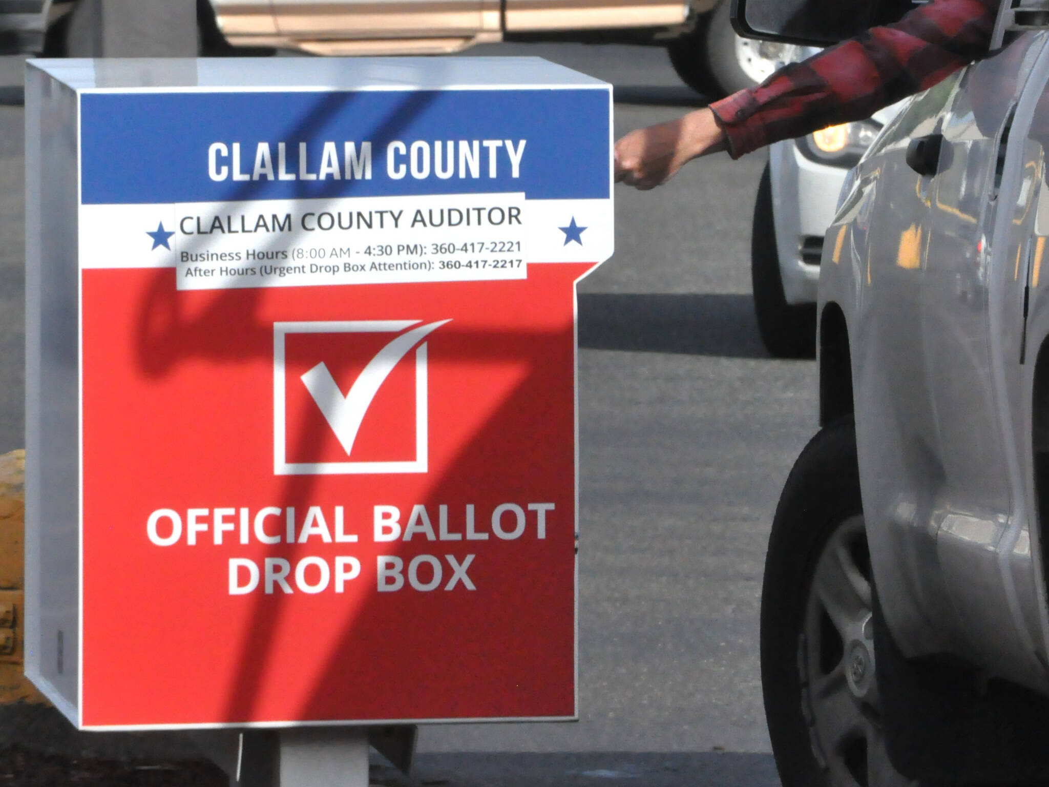 Sequim Gazette photo by Matthew Nash/ A voter drops off his ballot the morning of Election Day, Nov. 5 at the Sequim ballot box at 651 W. Washington St.