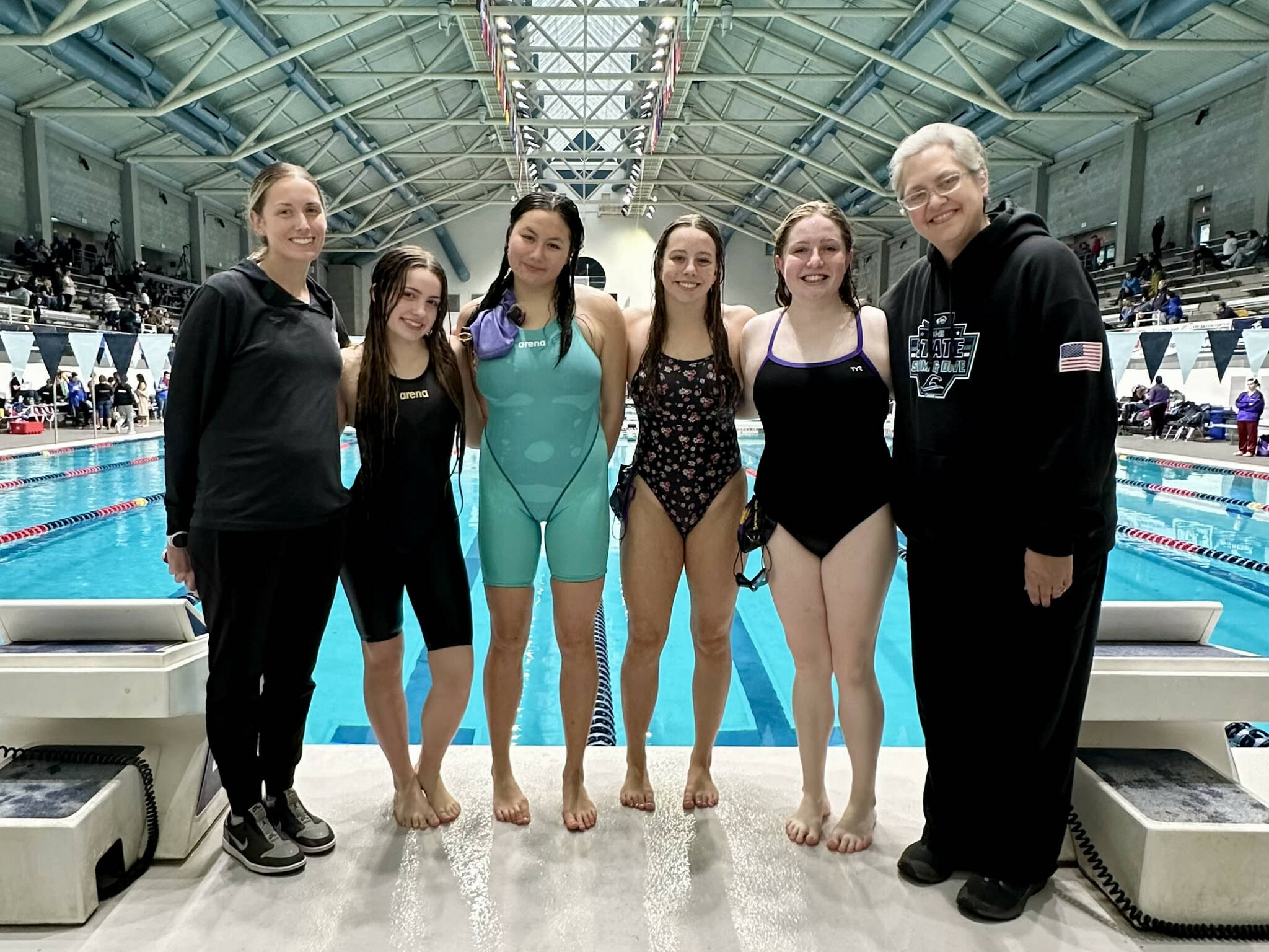 Photo courtesy Michelle Rhodes
Sequim’s girls swim team, from left, coach Sarah Thorson, Ava Shinkle, Melia Nelson, Annie Ellefson, Keira Morey, and coach Cherise Feser stand together at the 1A/2A state swim meet inside the King County Aquatic Center. As a team, Sequim placed 21st out of 40 teams with only four swimmers competing.