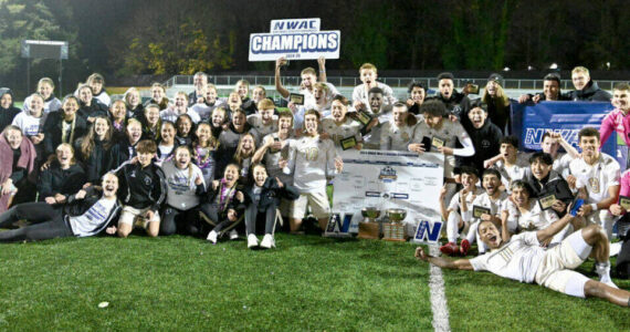 Photo courtesy Peninsula College
The Peninsula College men’s and women’s soccer teams celebrate their dual championships Sunday (Nov. 17) in Tukwila after the men beat Clark College 3-0 in their finals match and the women won 1-0 over Bellevue.