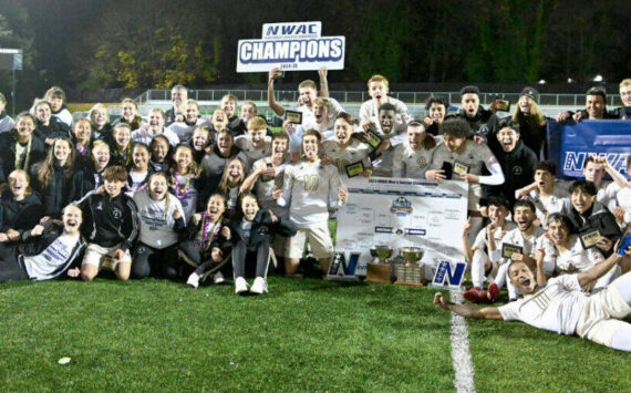 Photo courtesy Peninsula College
The Peninsula College men’s and women’s soccer teams celebrate their dual championships Sunday (Nov. 17) in Tukwila after the men beat Clark College 3-0 in their finals match and the women won 1-0 over Bellevue.