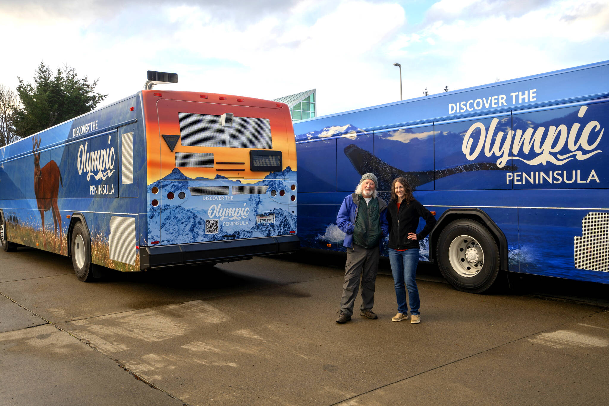 Photo by Paula Hunt, Olympic Peninsula News Group
Photographers John Gussman, left, and Becky Stinnett contributed their work to Clallam Transit System’s four wrapped buses that feature wildlife and landscapes on the Olympic Peninsula. The project was created to promote tourism and celebrate the beauty of the area.