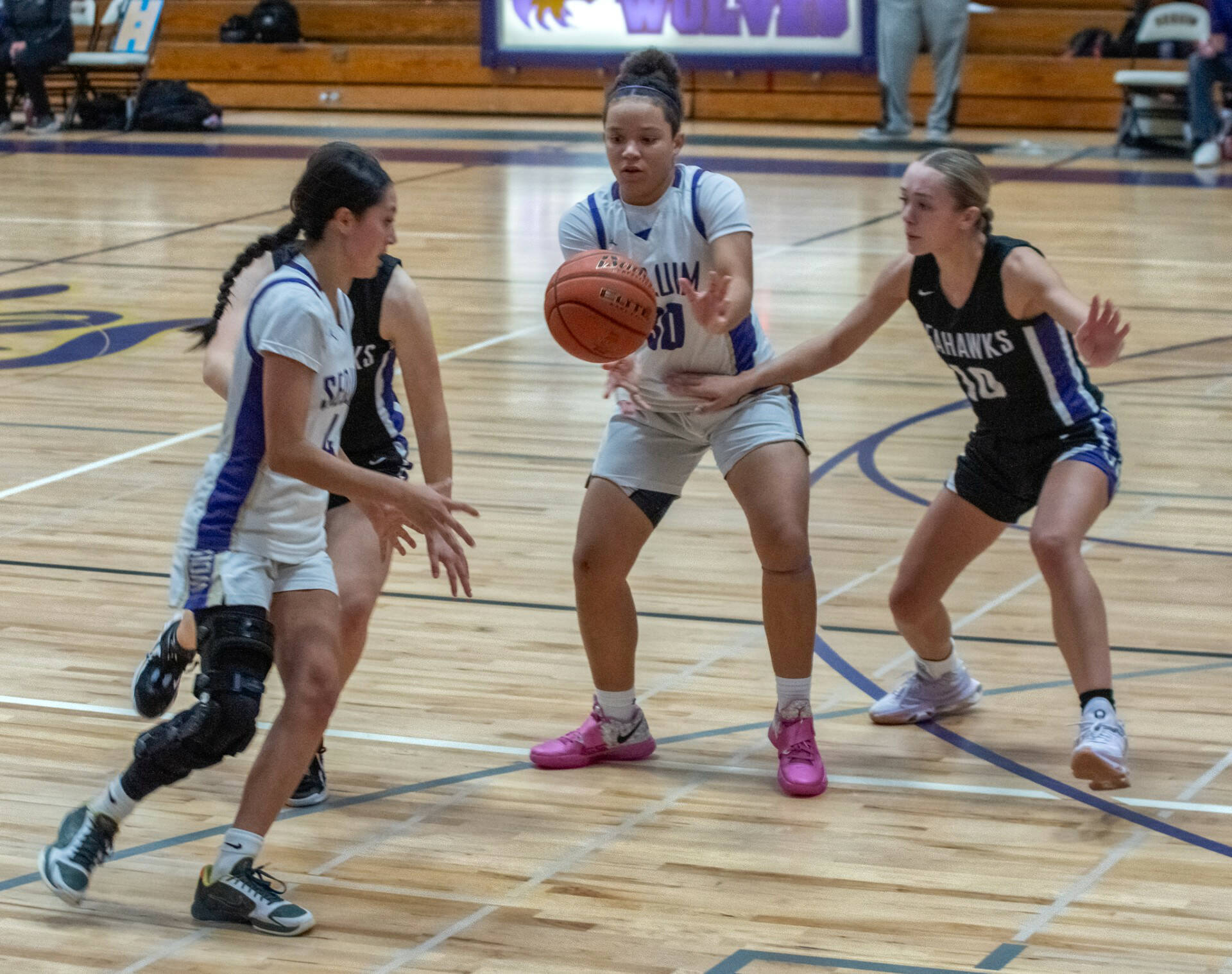 Sequim Gazette photo by Emily Matthiessen
Sequim’s Gracie Chartraw, left, and Bobbi Mixon, with ball, are key returners to the Wolves’ girls basketball squad. While they lost the season opener against Anacortes, they returned two nights later to defeat Kingston, with Chartraw scoring 20, and Mixon dishing out seven assists and making six steals.