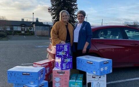 Photo courtesy Linda Klinefelter
The Sequim Food Bank made a request of Soroptimist International of Sequim to assist with providing larger size diapers and the group’s membership stepped up and provided 14 cases of diapers in sizes 4-6 earlier this month. Linda Klinefelter, president of SIS, on right, presented Andra Smith, executive director of the Sequim Food Bank, with the donation.