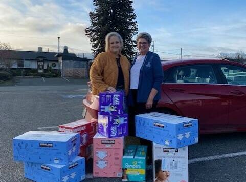 Photo courtesy Linda Klinefelter
The Sequim Food Bank made a request of Soroptimist International of Sequim to assist with providing larger size diapers and the group’s membership stepped up and provided 14 cases of diapers in sizes 4-6 earlier this month. Linda Klinefelter, president of SIS, on right, presented Andra Smith, executive director of the Sequim Food Bank, with the donation.