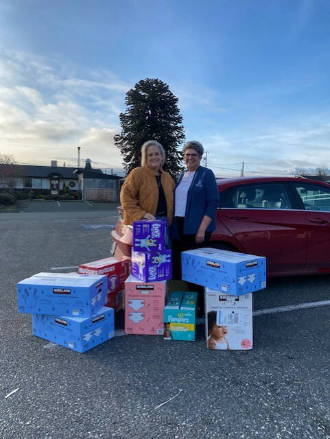 Photo courtesy Linda Klinefelter
The Sequim Food Bank made a request of Soroptimist International of Sequim to assist with providing larger size diapers and the group’s membership stepped up and provided 14 cases of diapers in sizes 4-6 earlier this month. Linda Klinefelter, president of SIS, on right, presented Andra Smith, executive director of the Sequim Food Bank, with the donation.